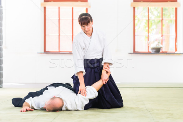 Man and woman fighting at Aikido martial arts school Stock photo © Kzenon