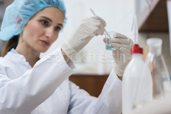 Stock photo: Dedicated chemist creating an innovative substance in the labora