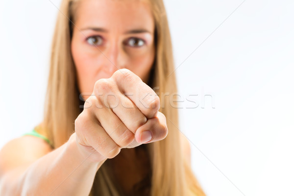 Young woman showing punch Stock photo © Kzenon
