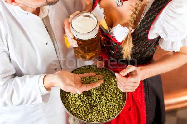 brewer and woman with beer glass in brewery Stock photo © Kzenon