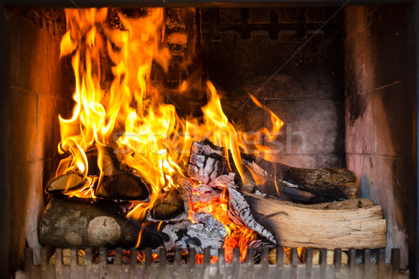 Fogão chamas lareira confortável fogo quente Foto stock © Kzenon