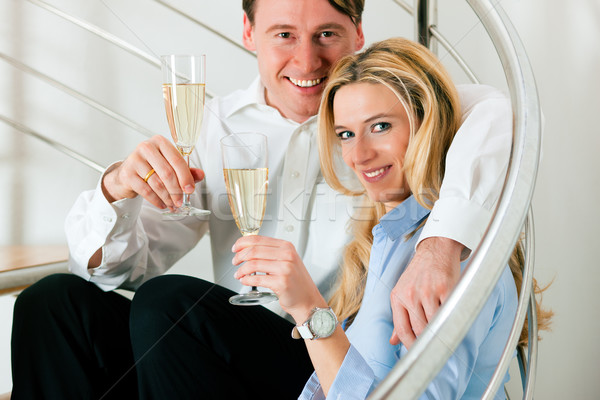 Business Couple at home with champagne Stock photo © Kzenon