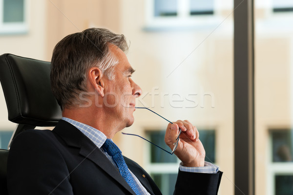 Business - Boss contemplating in his office Stock photo © Kzenon