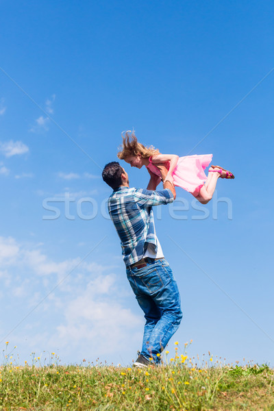 Daddy spinning around his daughter Stock photo © Kzenon