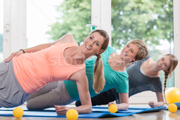 Women doing exercises for pelvis floor in postnatal regression c Stock photo © Kzenon