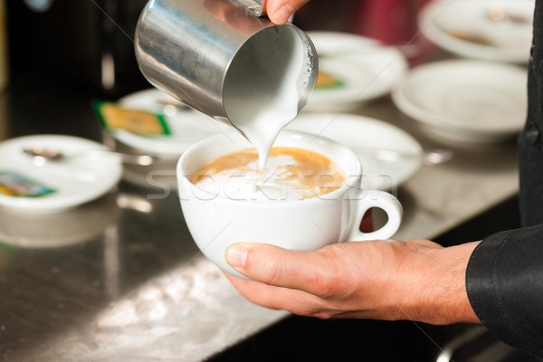Barista készít cappucchino kávézó közelkép kéz Stock fotó © Kzenon