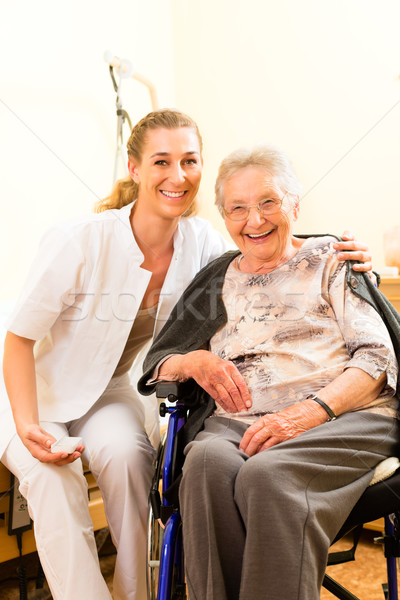 Stock photo: Young nurse and female senior in nursing home