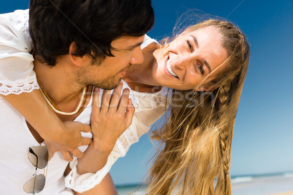 Couple enjoying freedom on the beach Stock photo © Kzenon