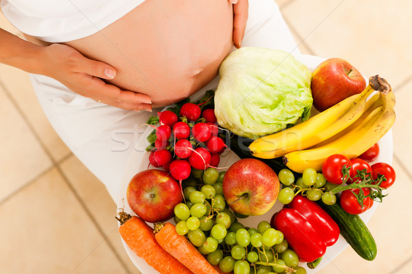 Gravidez nutrição mulher grávida tigela fruto legumes Foto stock © Kzenon