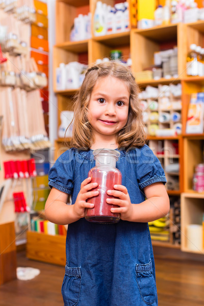 Child with color or paint pigments in store Stock photo © Kzenon