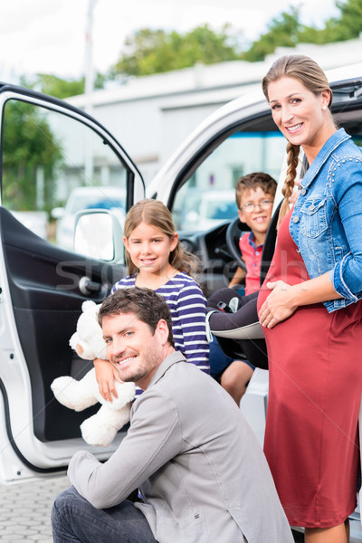 Family buying car, mother, father and child at dealership Stock photo © Kzenon