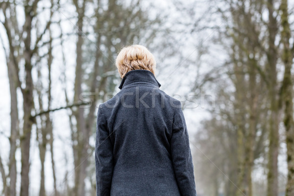 Unhappy woman having walk in winter Stock photo © Kzenon