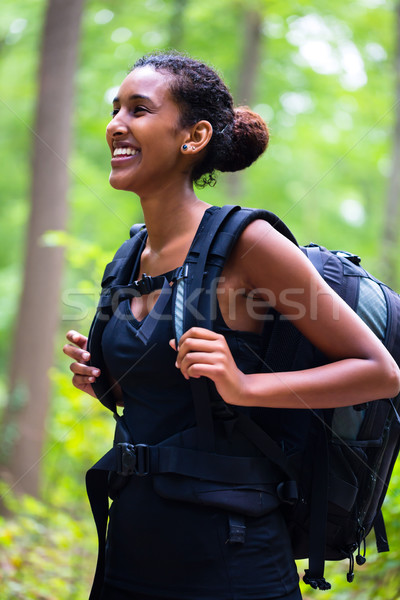 African young woman hiking on forest track  Stock photo © Kzenon