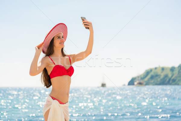 Mooie jonge vrouw modieus gestreept hoed Stockfoto © Kzenon