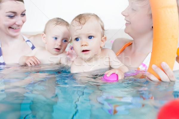 Mothers being happy about their babies playing with each other Stock photo © Kzenon