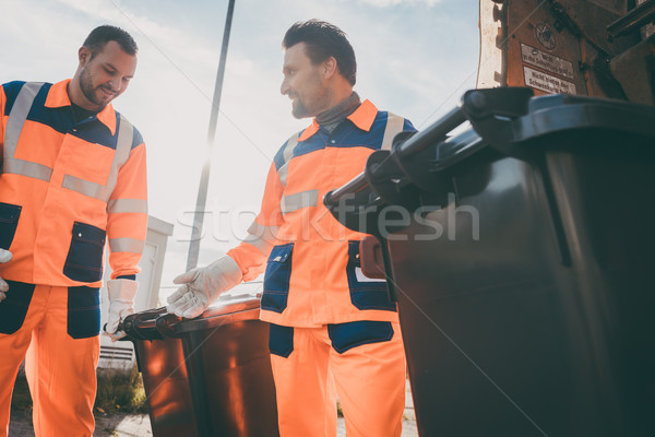 Stock photo: Garbage removal men working for a public utility