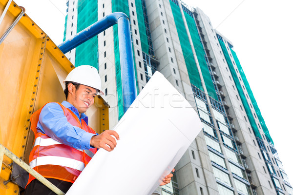 Stock photo: Asian worker or supervisor on building site 