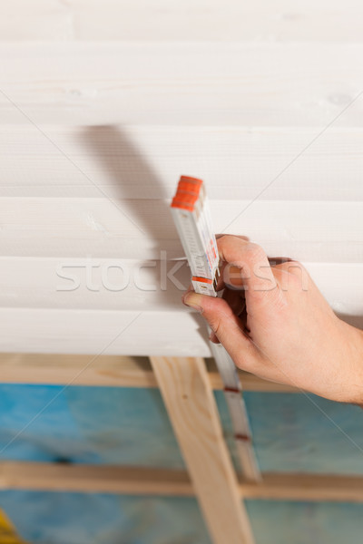 Dry waller with measuring with folding rule Stock photo © Kzenon