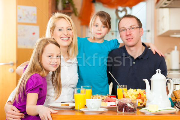 Family having food for breakfast Stock photo © Kzenon