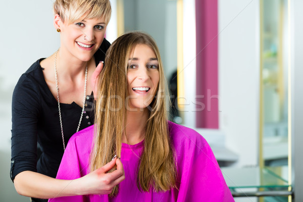 Woman at the hairdresser getting advise Stock photo © Kzenon
