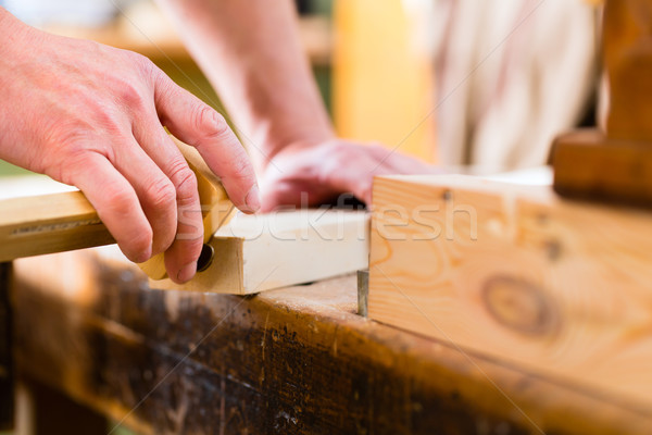 Carpenter with workpiece in carpentry Stock photo © Kzenon