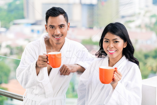 Asian couple in morning front of city skyline Stock photo © Kzenon