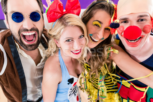 Party people celebrating carnival or new years eve Stock photo © Kzenon
