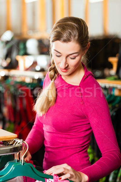 Woman is buying Tracht or dirndl in a shop Stock photo © Kzenon