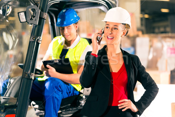 Stock photo: Forklift driver and supervisor at warehouse