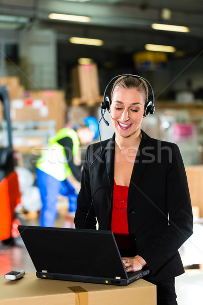 dispatcher using headset at warehouse of forwarding Stock photo © Kzenon
