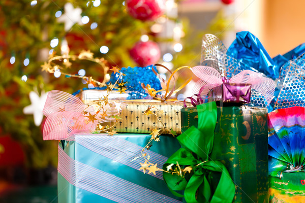 Christmas gifts under x-mas tree Stock photo © Kzenon