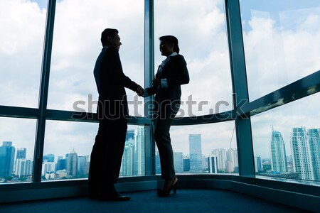 Asian business partners shaking hands Stock photo © Kzenon