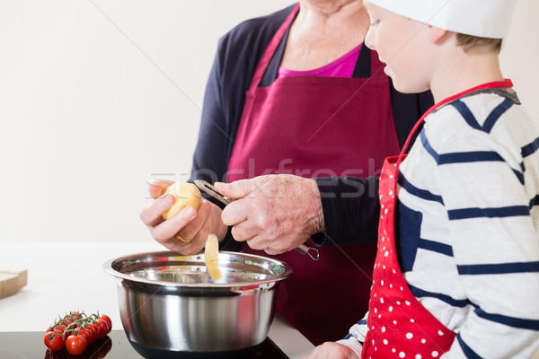 Grandma and grandson cooking together Stock photo © Kzenon