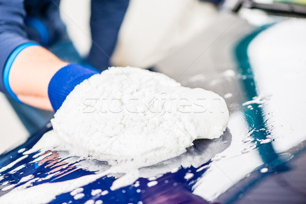 Close-up of hand wiping car with microfiber wash mitt Stock photo © Kzenon