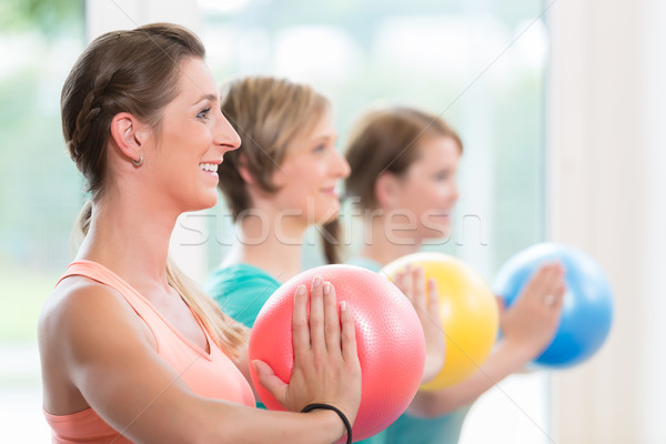 Young women doing  yoga during postnatal recovery lesson Stock photo © Kzenon