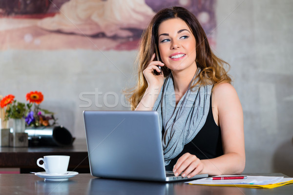 Student or businesswoman working in cafe Stock photo © Kzenon
