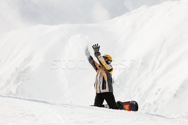 Stock photo: Snowboarder in the snow 