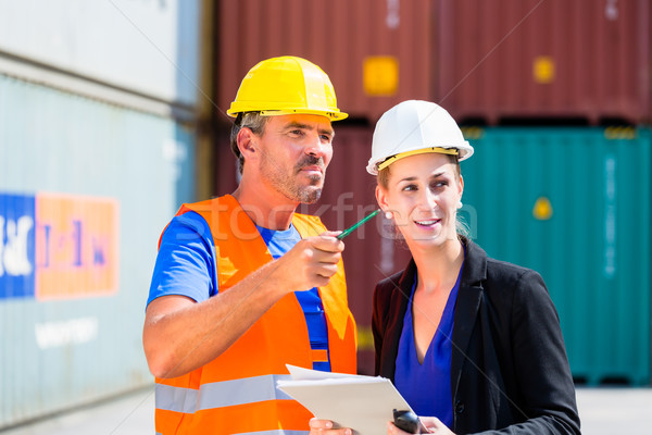 Employees in logistics company shipping containers Stock photo © Kzenon