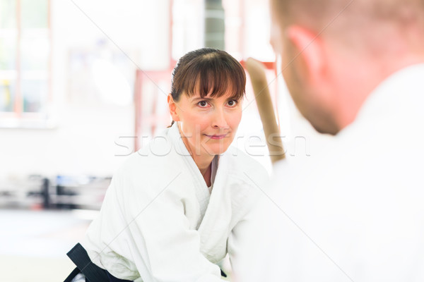 Man and woman having Aikido sword fight  Stock photo © Kzenon