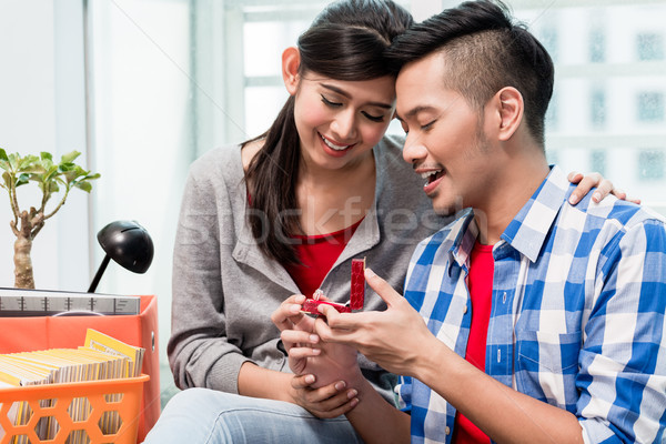 Young Indonesian man makes proposal to girlfriend  Stock photo © Kzenon