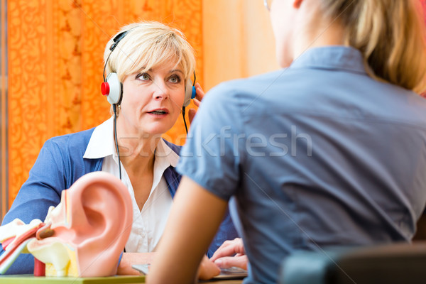 Deaf woman takes a hearing test Stock photo © Kzenon