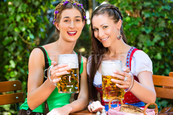 In Beer garden - friends drinking beer in bavaria Stock photo © Kzenon