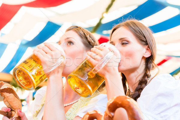 Friends in Bavarian beer tent drinking Stock photo © Kzenon
