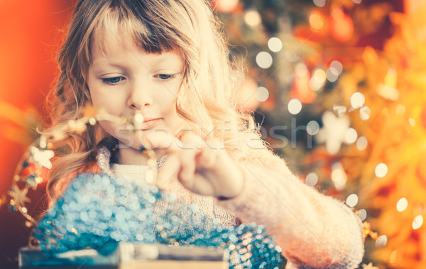 Christmas, happy girl with Xmas present on Christmas Eve Stock photo © Kzenon