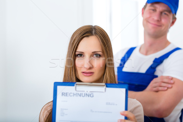 Craftsman or plumber giving overpriced invoice  Stock photo © Kzenon