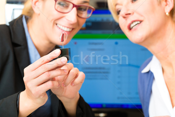Deaf woman makes a hearing test Stock photo © Kzenon
