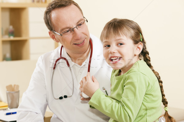 Pediatrician doctor with child patient Stock photo © Kzenon
