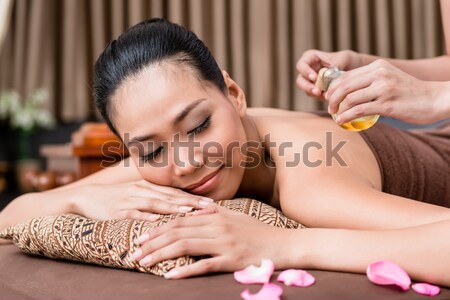 Indonesian woman wellness massage in spa Stock photo © Kzenon