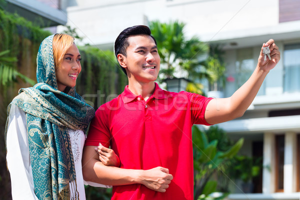 Asian Muslim couple moving into house Stock photo © Kzenon