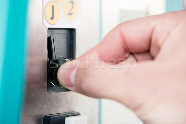 Close-up of male hand using coin-operated machine Stock photo © Kzenon